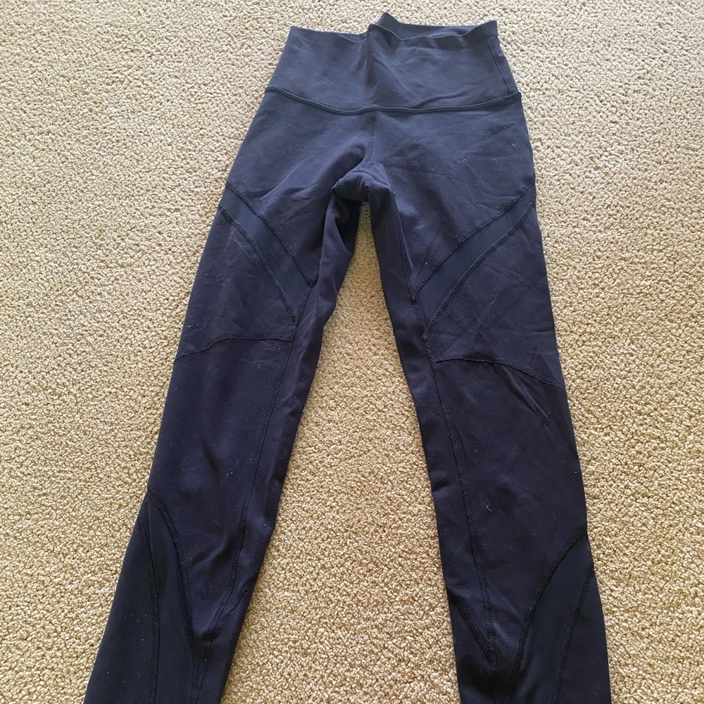 Lululemon black high leggings with mesh cutouts